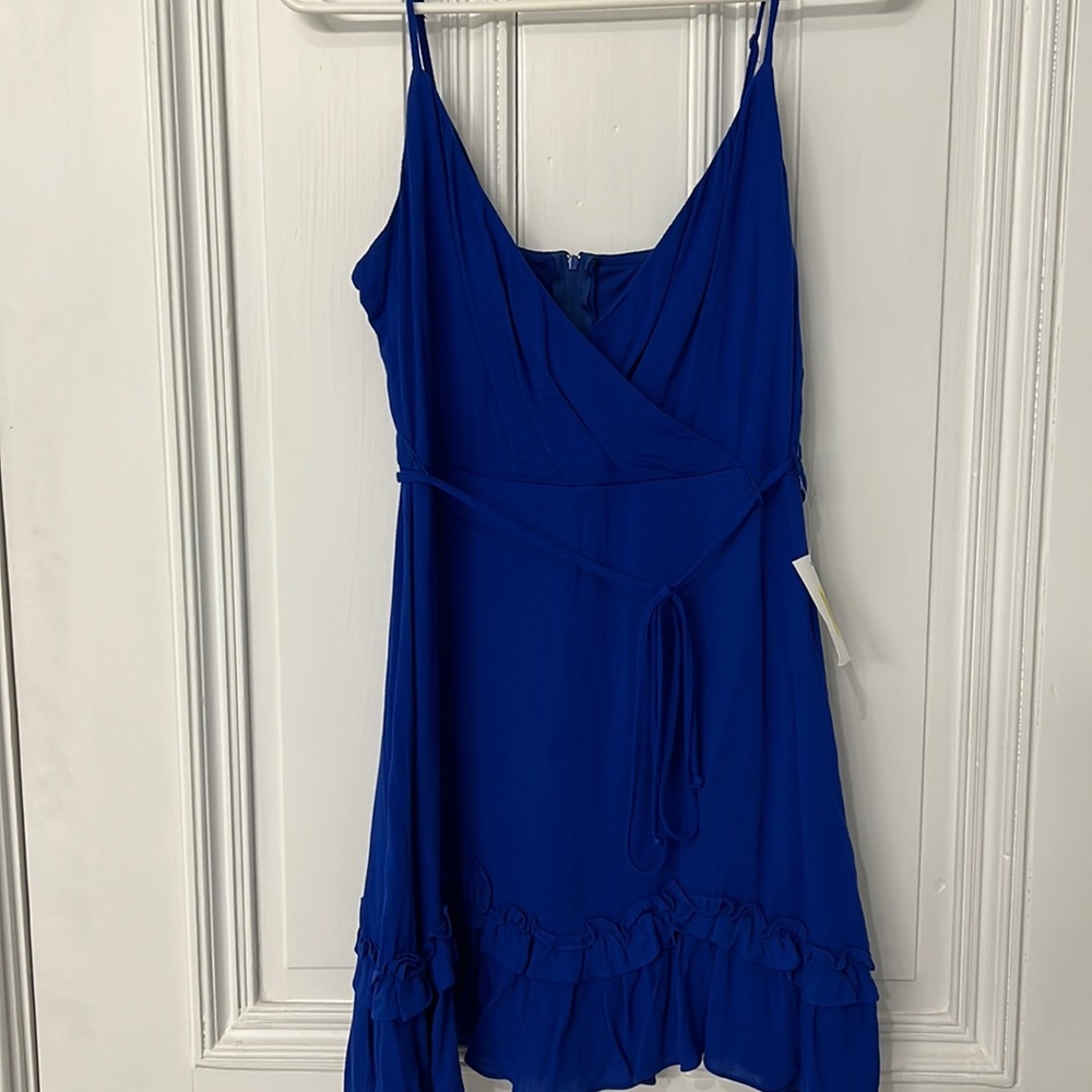 Beautiful dress with adjustable straps and ruffle details